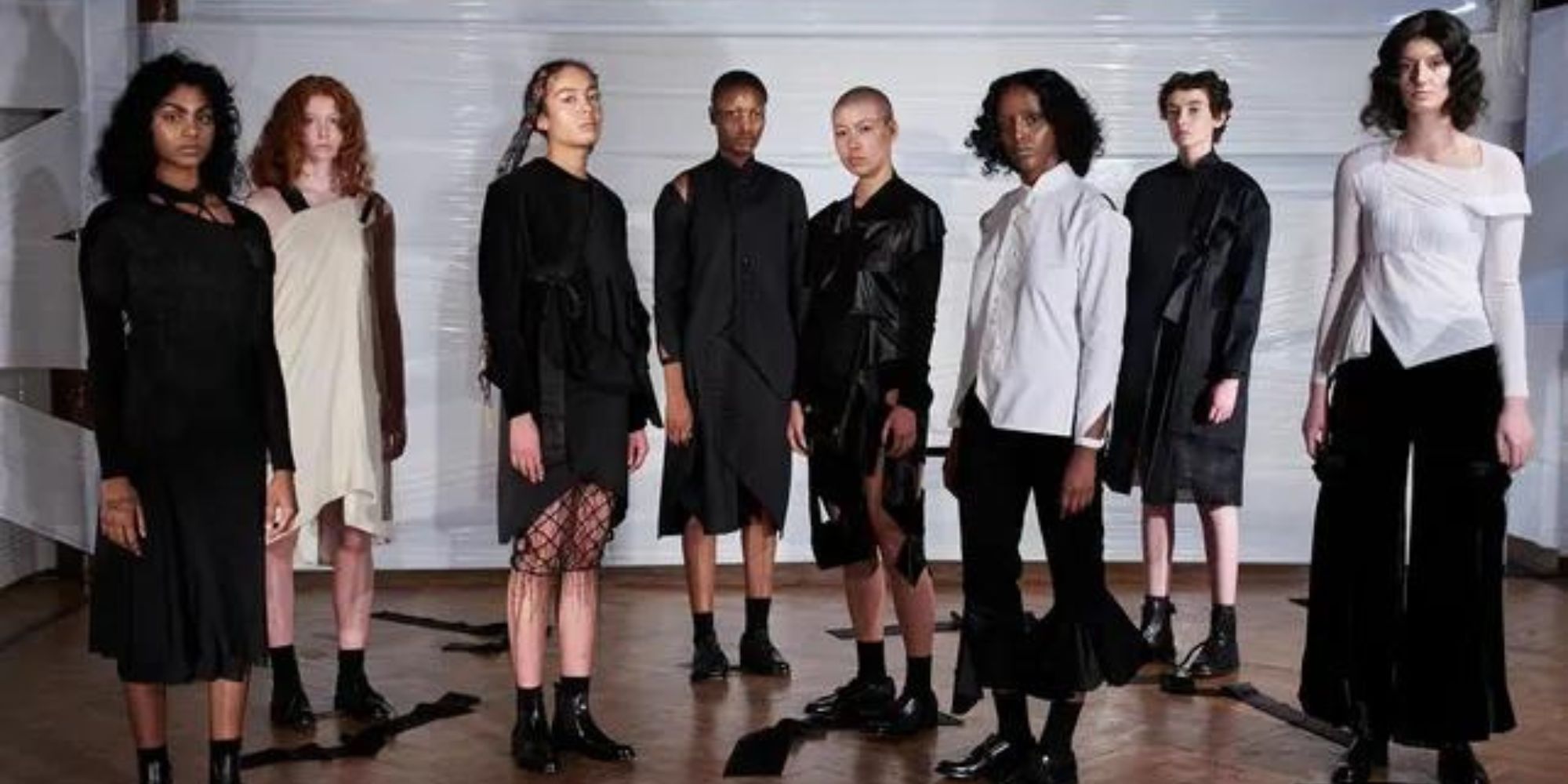 A group of people wearing made-to-order circular fashion by Phoebe English.