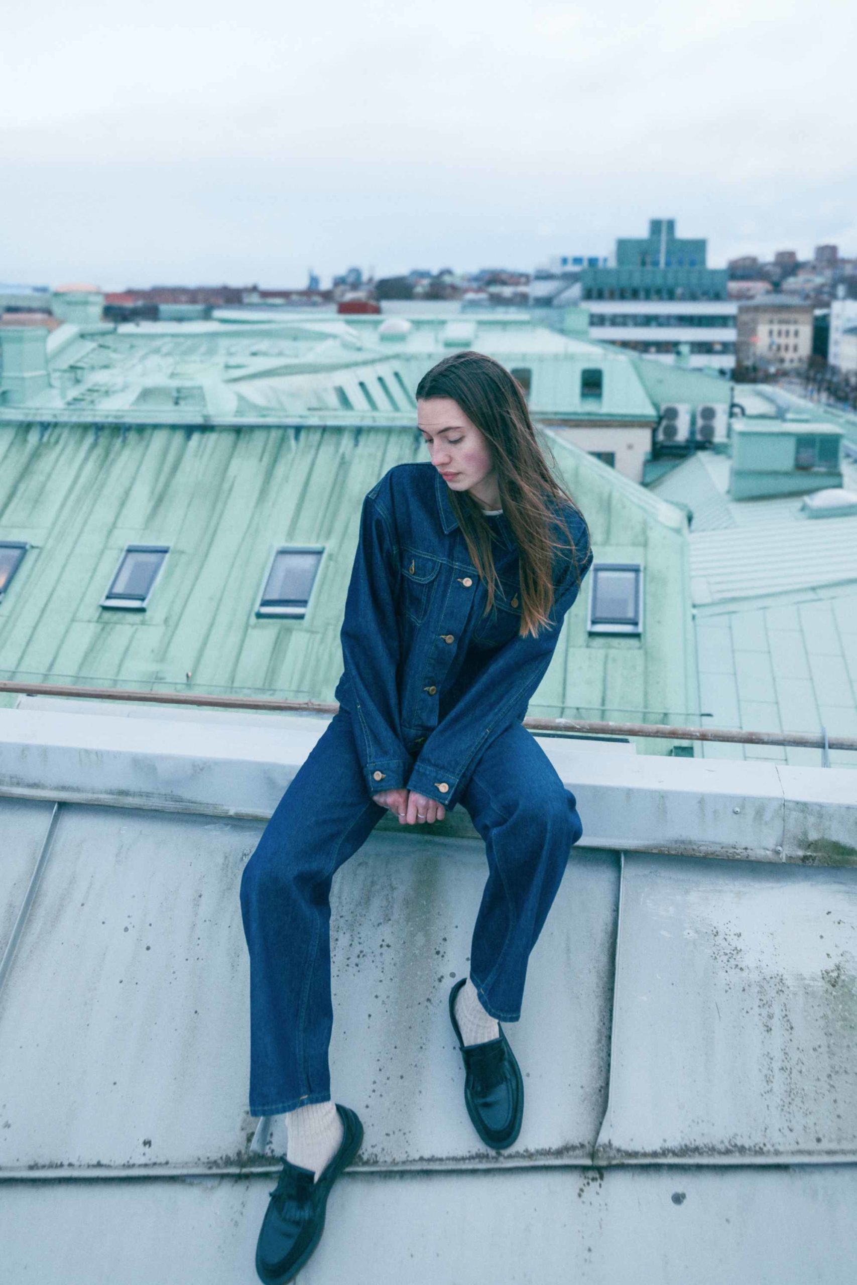 Woman wearing blue denim from Nudie Jeans