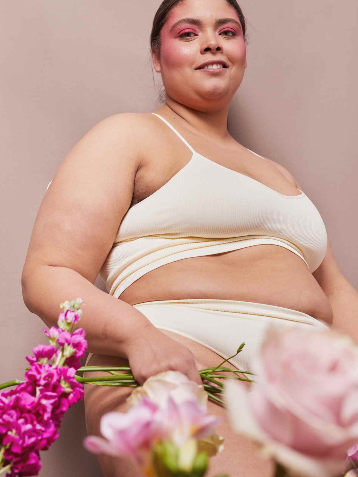 person smiling wearing underwear