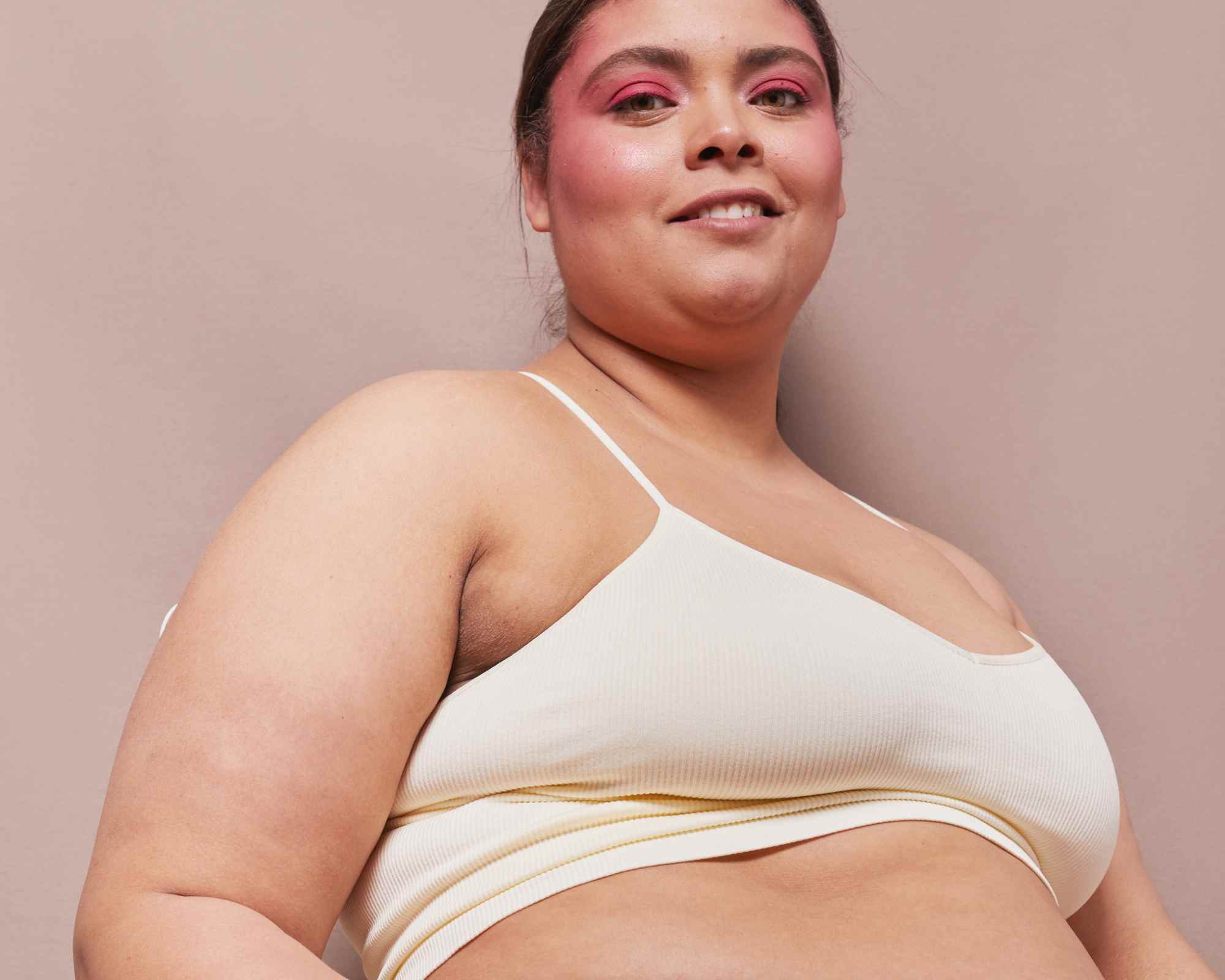 person smiling wearing underwear