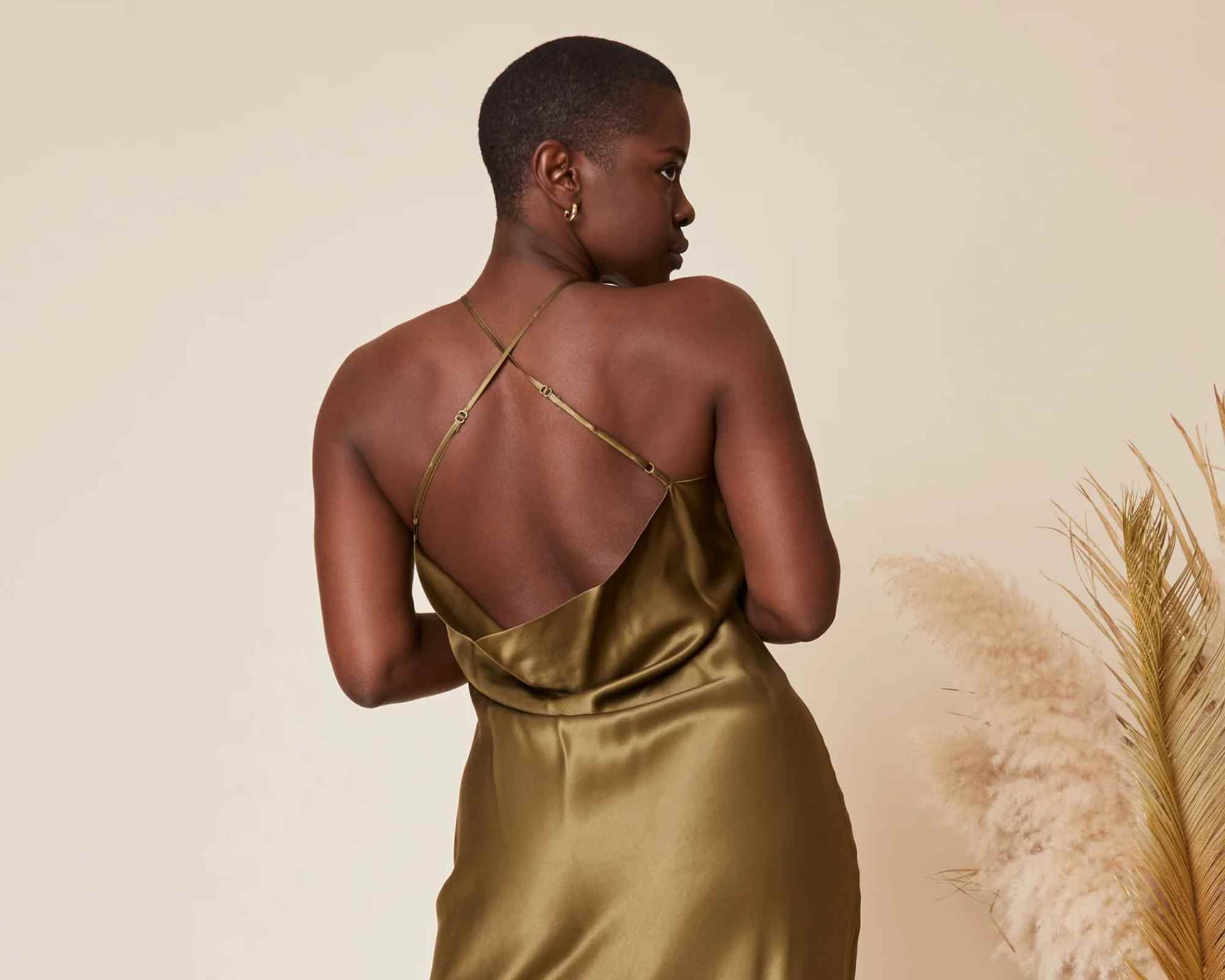 person wearing more sustainable wedding guest outfit from whimsy and row