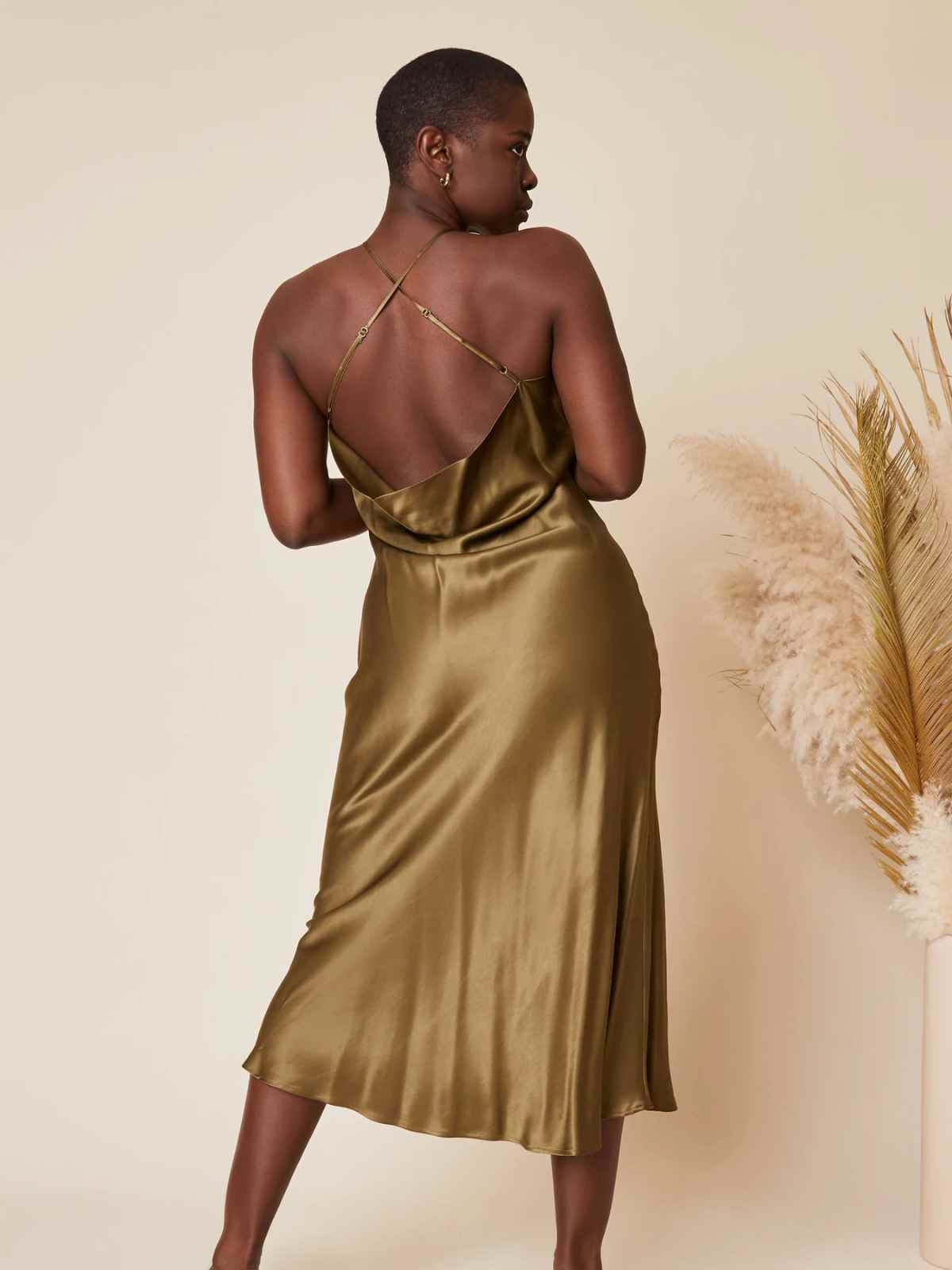 person wearing more sustainable wedding guest outfit from whimsy and row