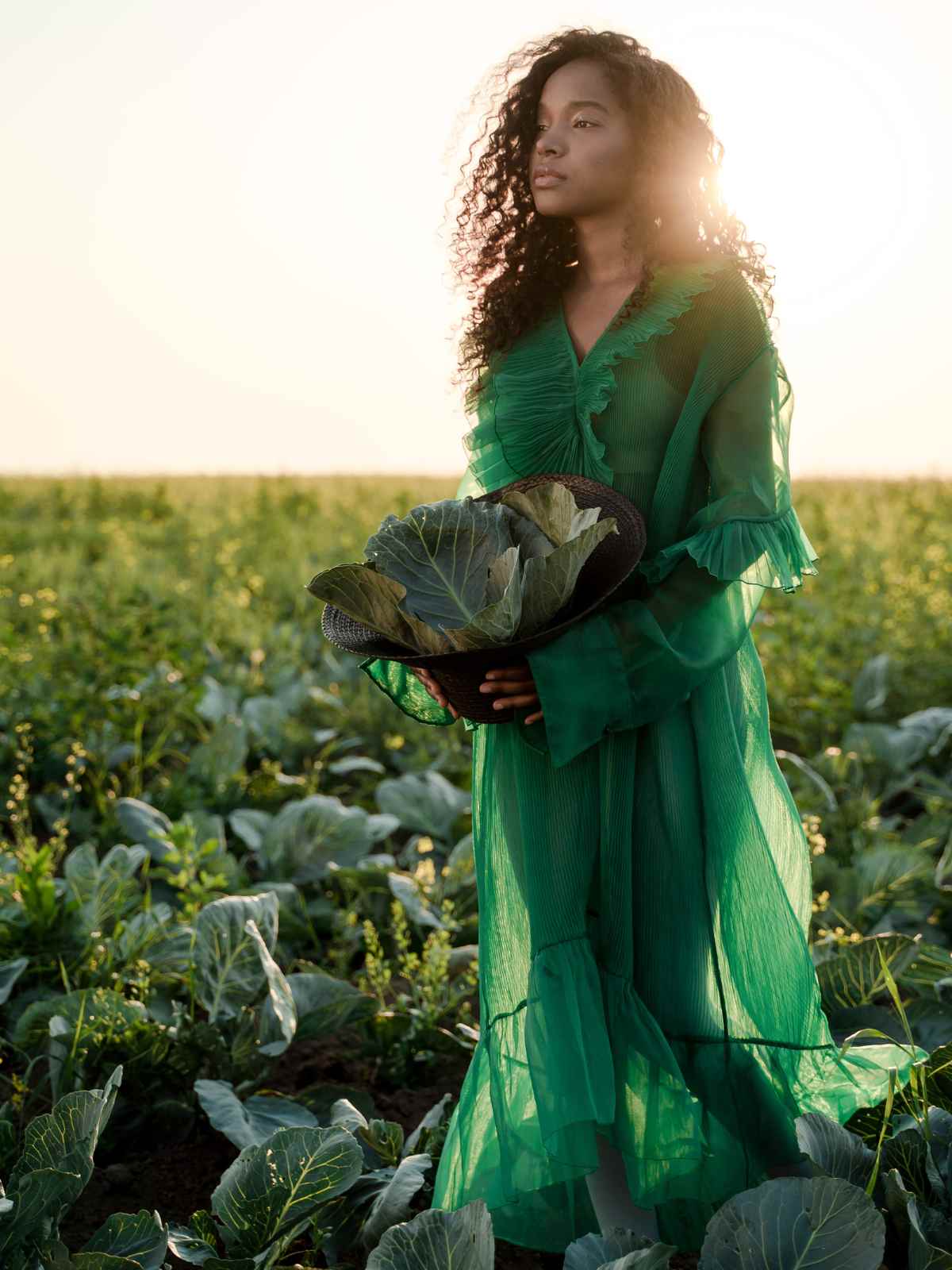 Person wearing a green dress in a field