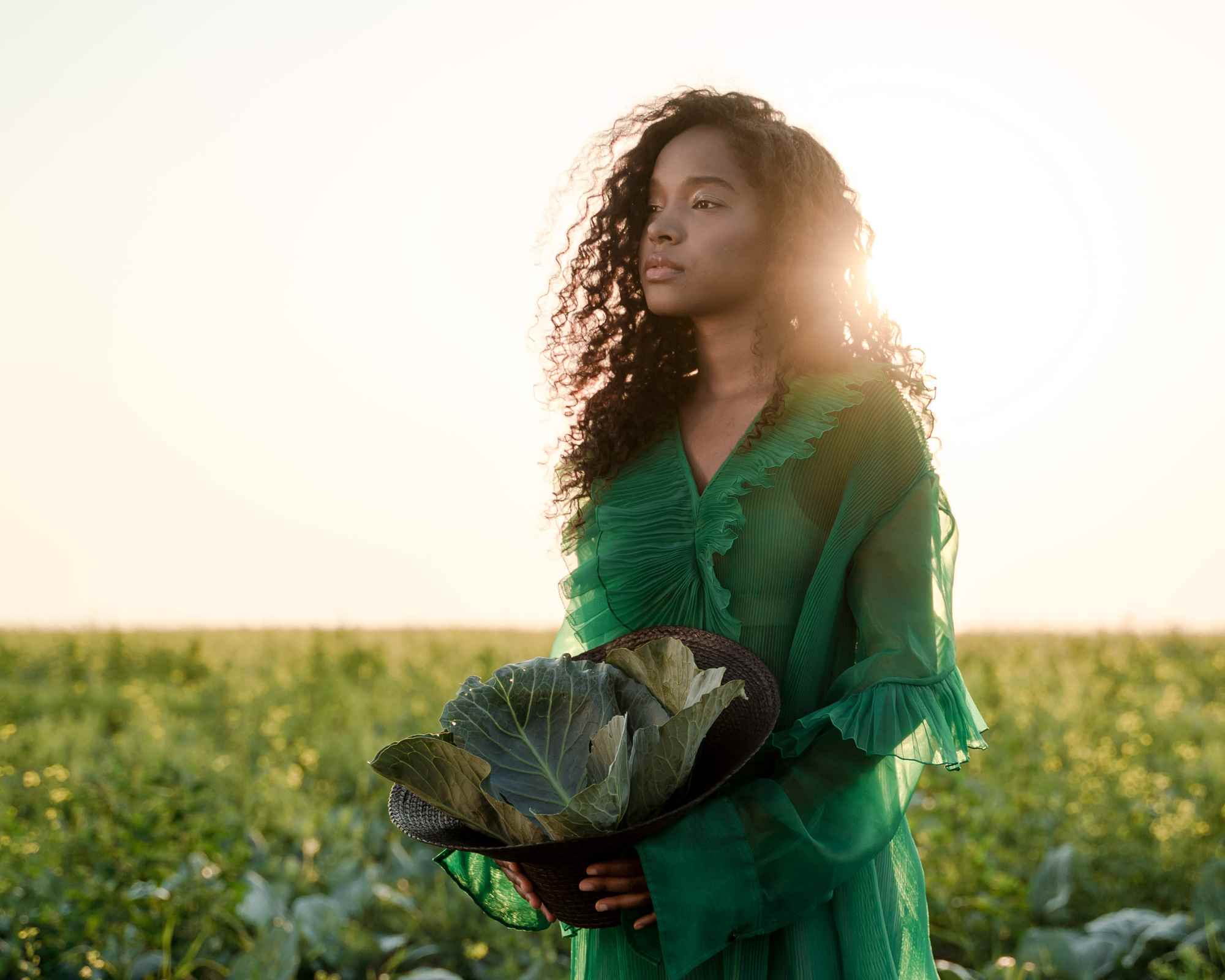 Person wearing a green dress in a field