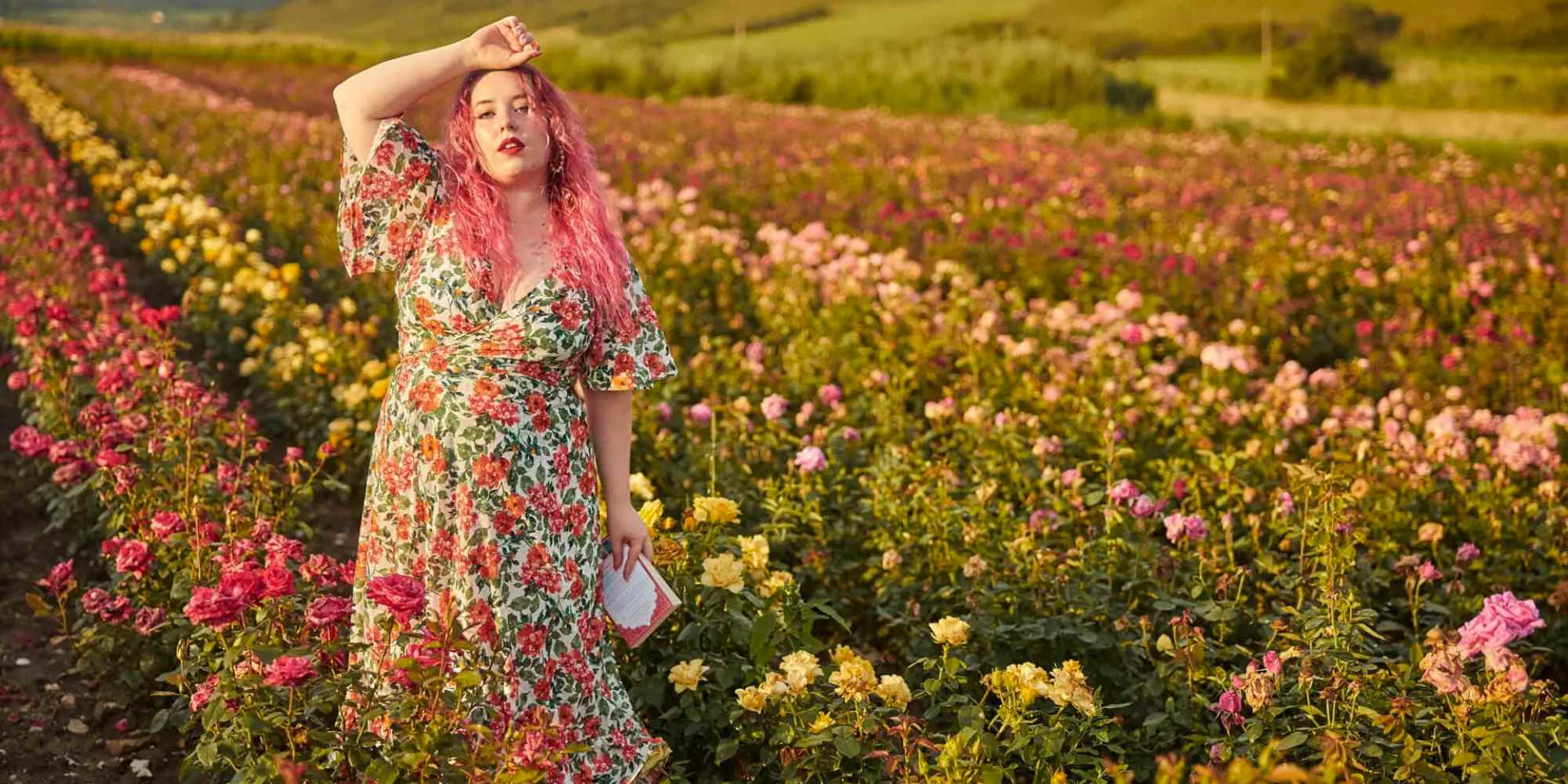 Person wearing printed dress in flower field