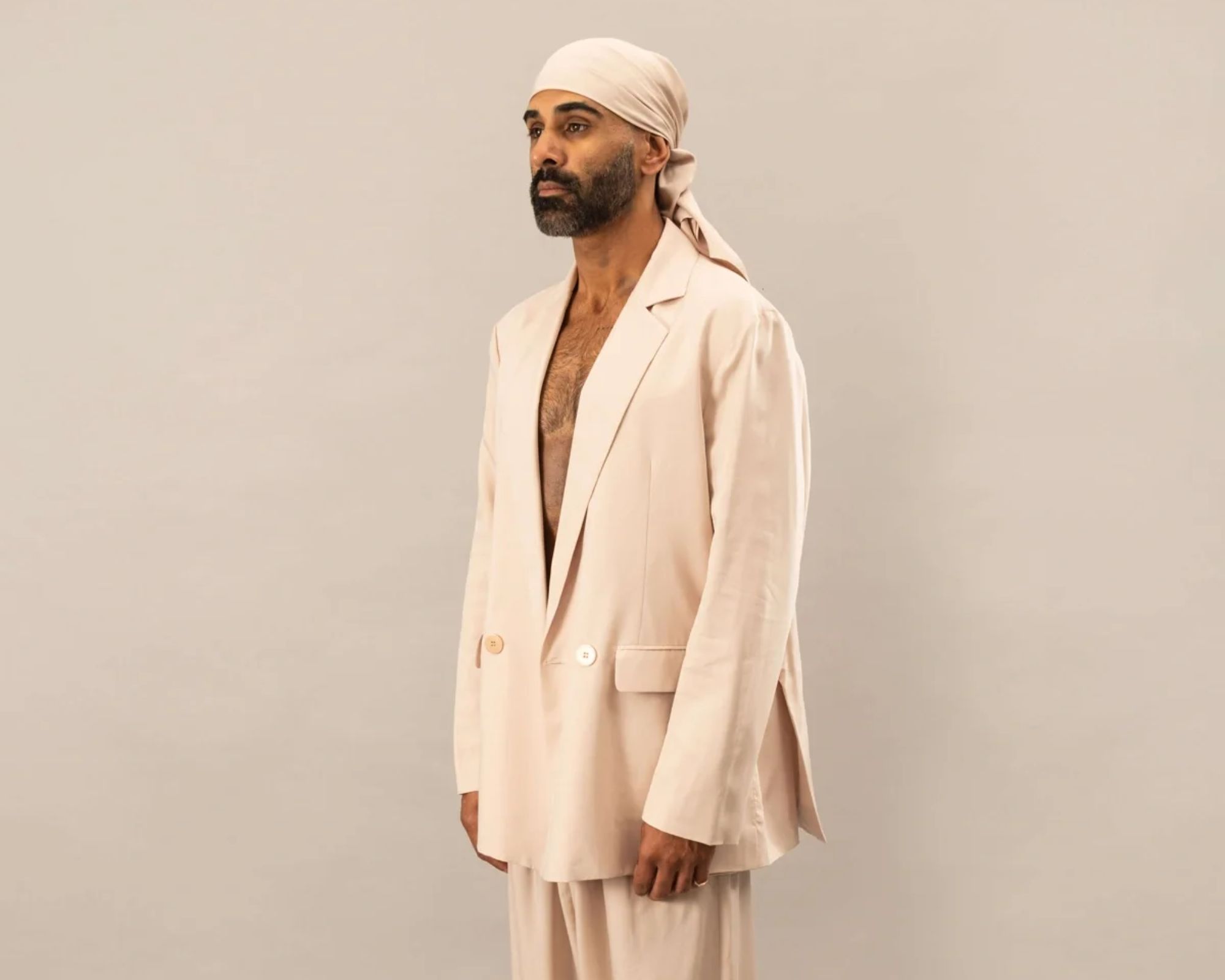 person wearing more sustainable tailoring from The Glade