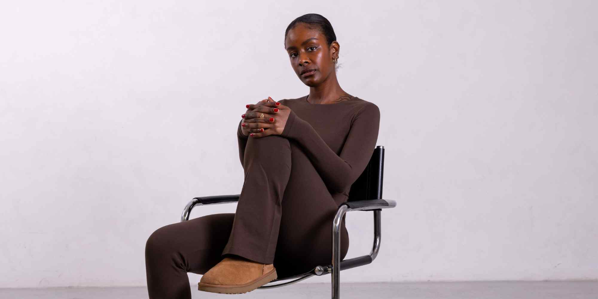 Person wearing brown outfit from more sustainable fashion brand Not Basics