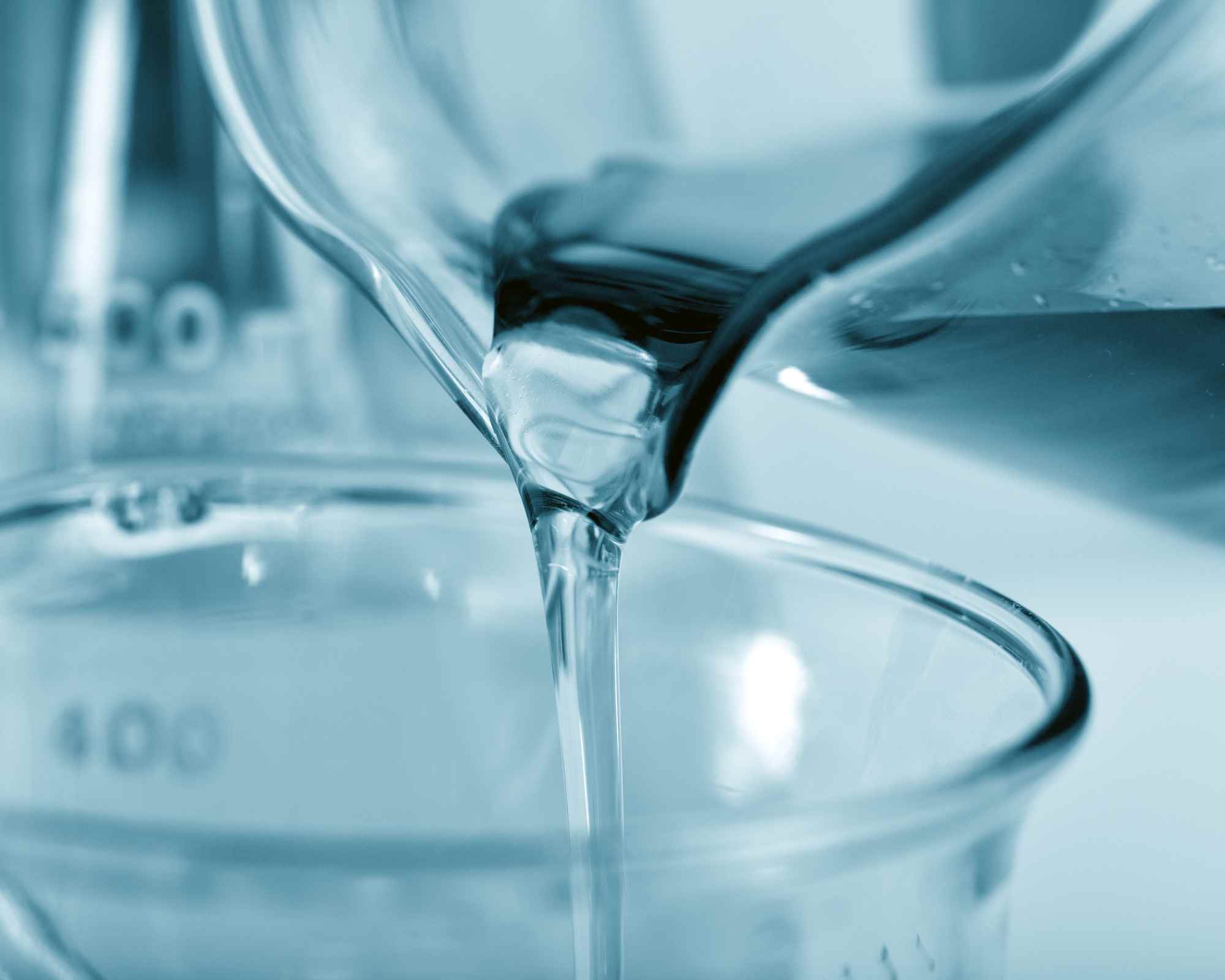 Water pouring from a jug into container