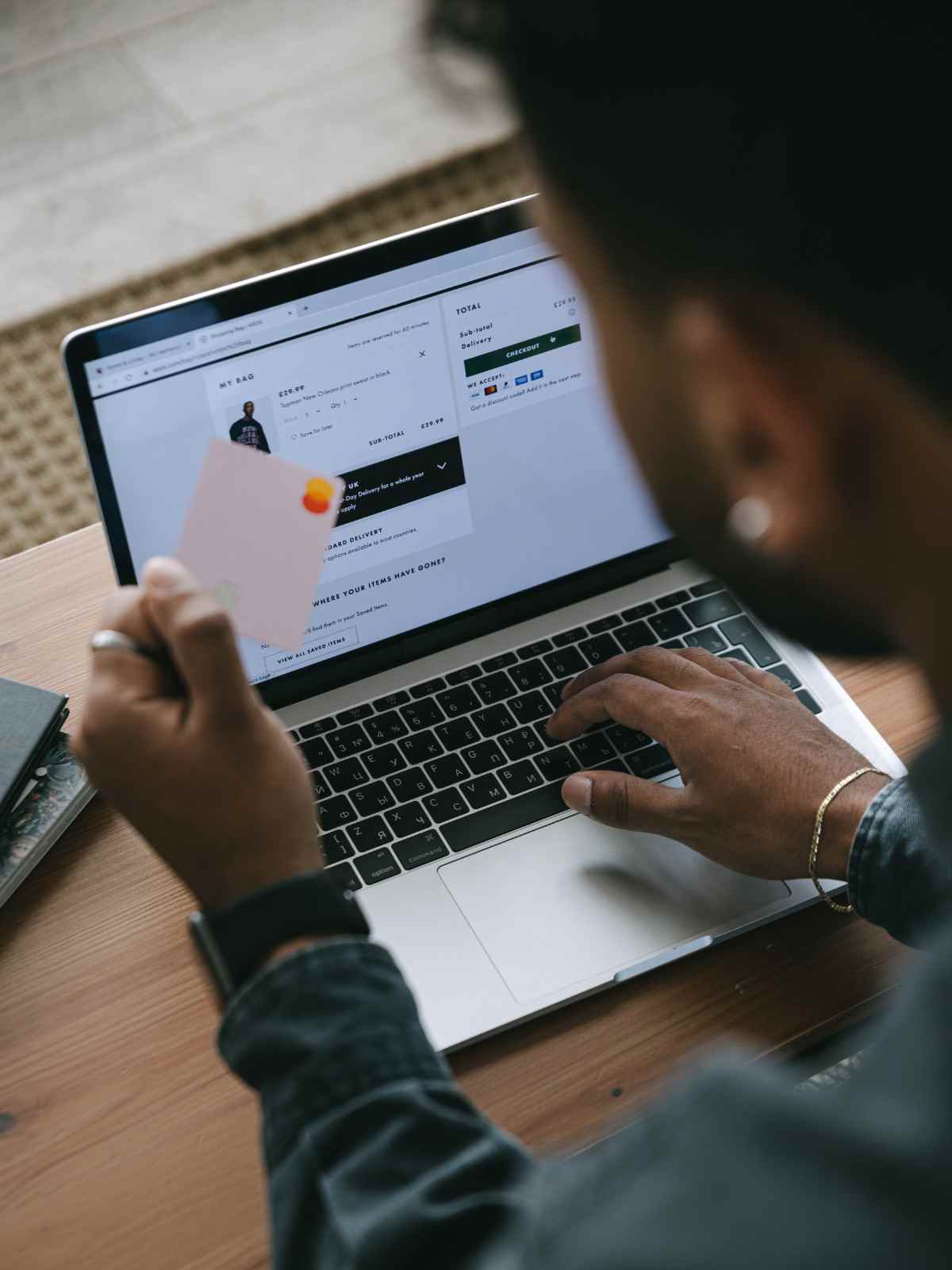 person using a credit card to shop online