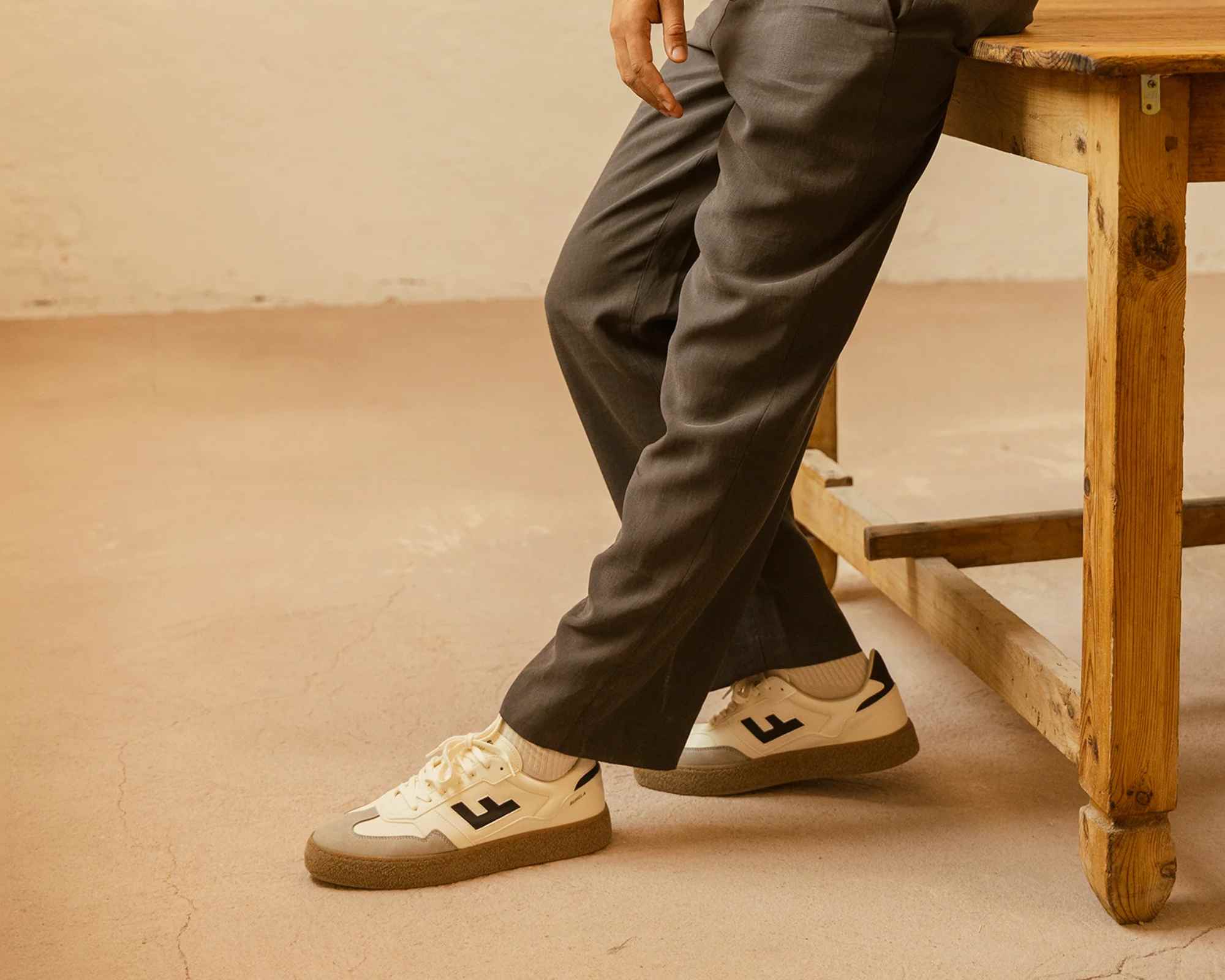 Person wearing white Flamingos Life sneakers