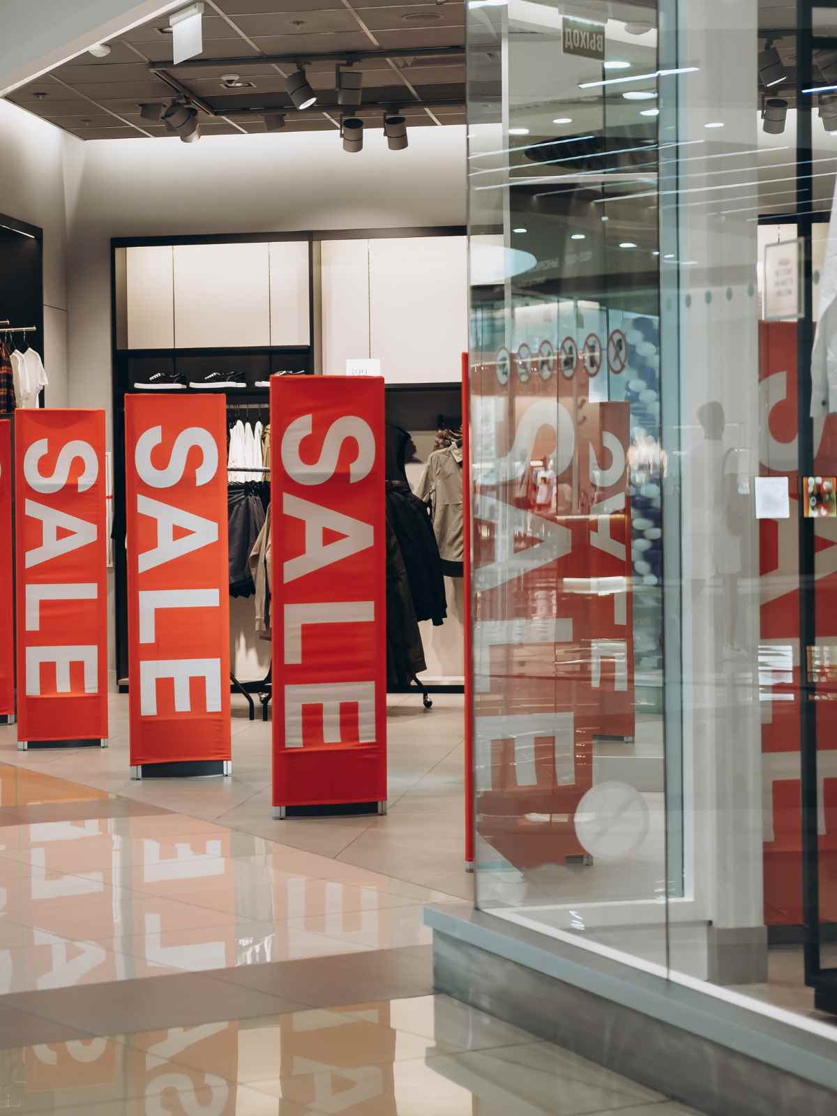 a storefront with black friday sale signs