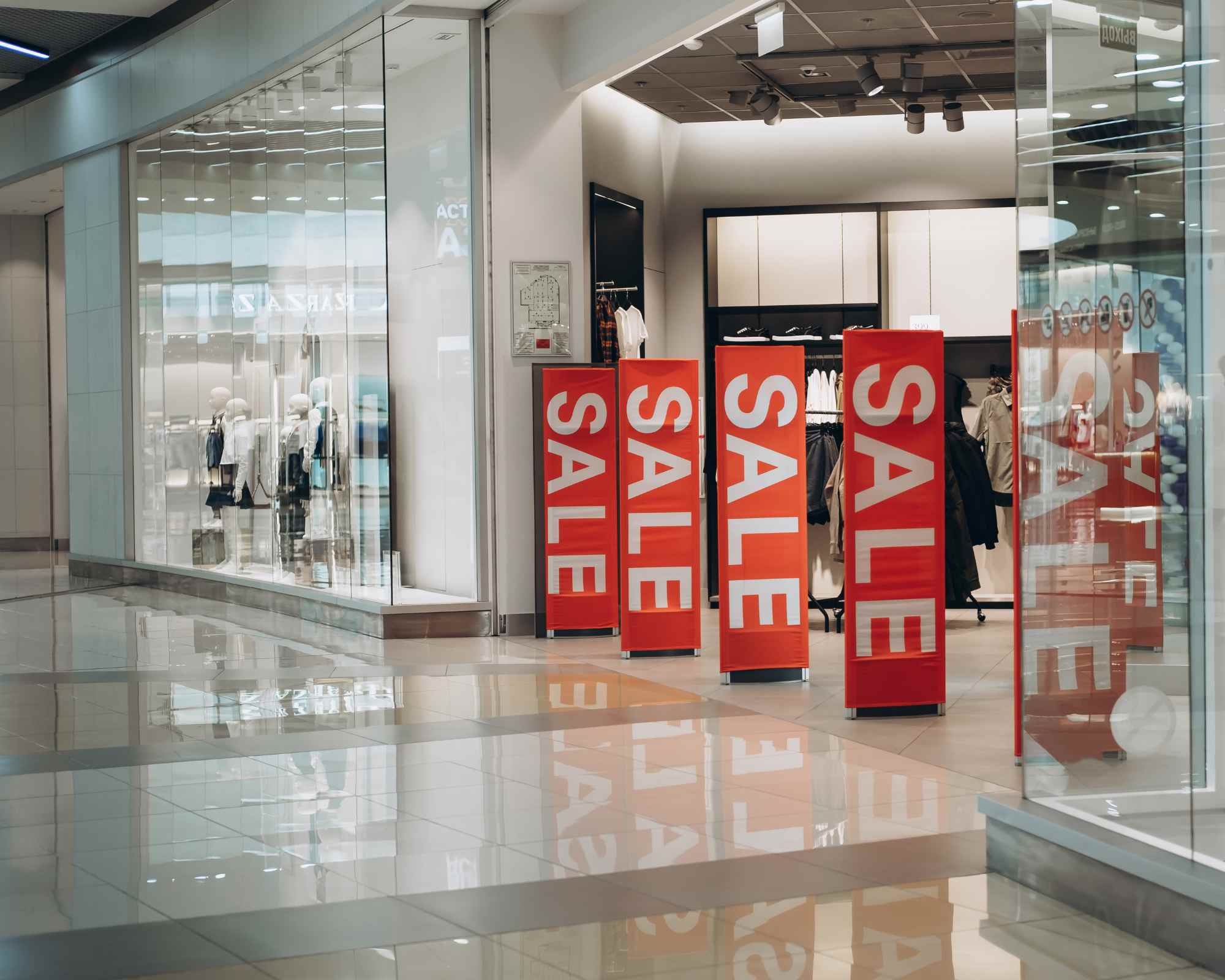 a storefront with black friday sale signs