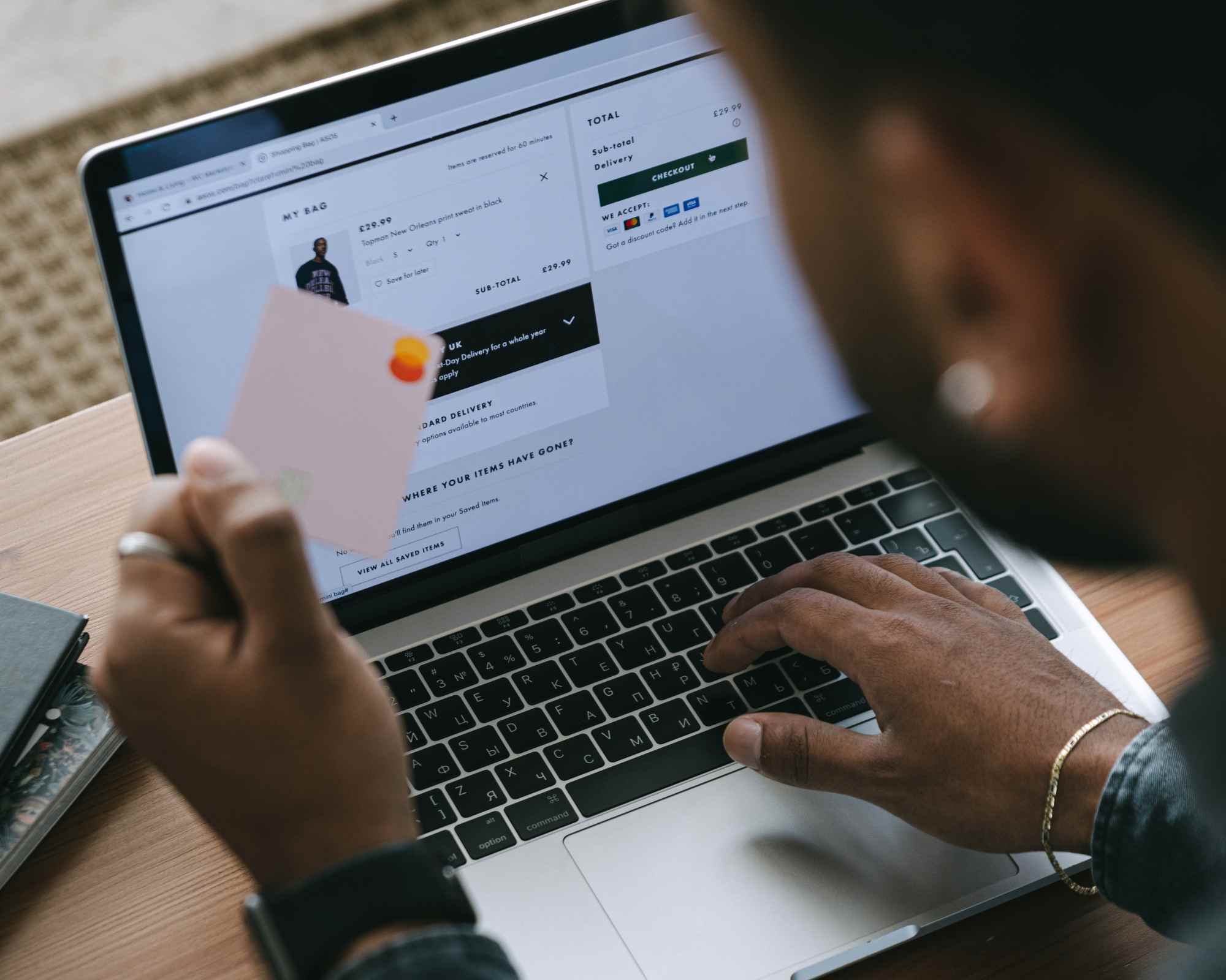 person using a credit card to shop online