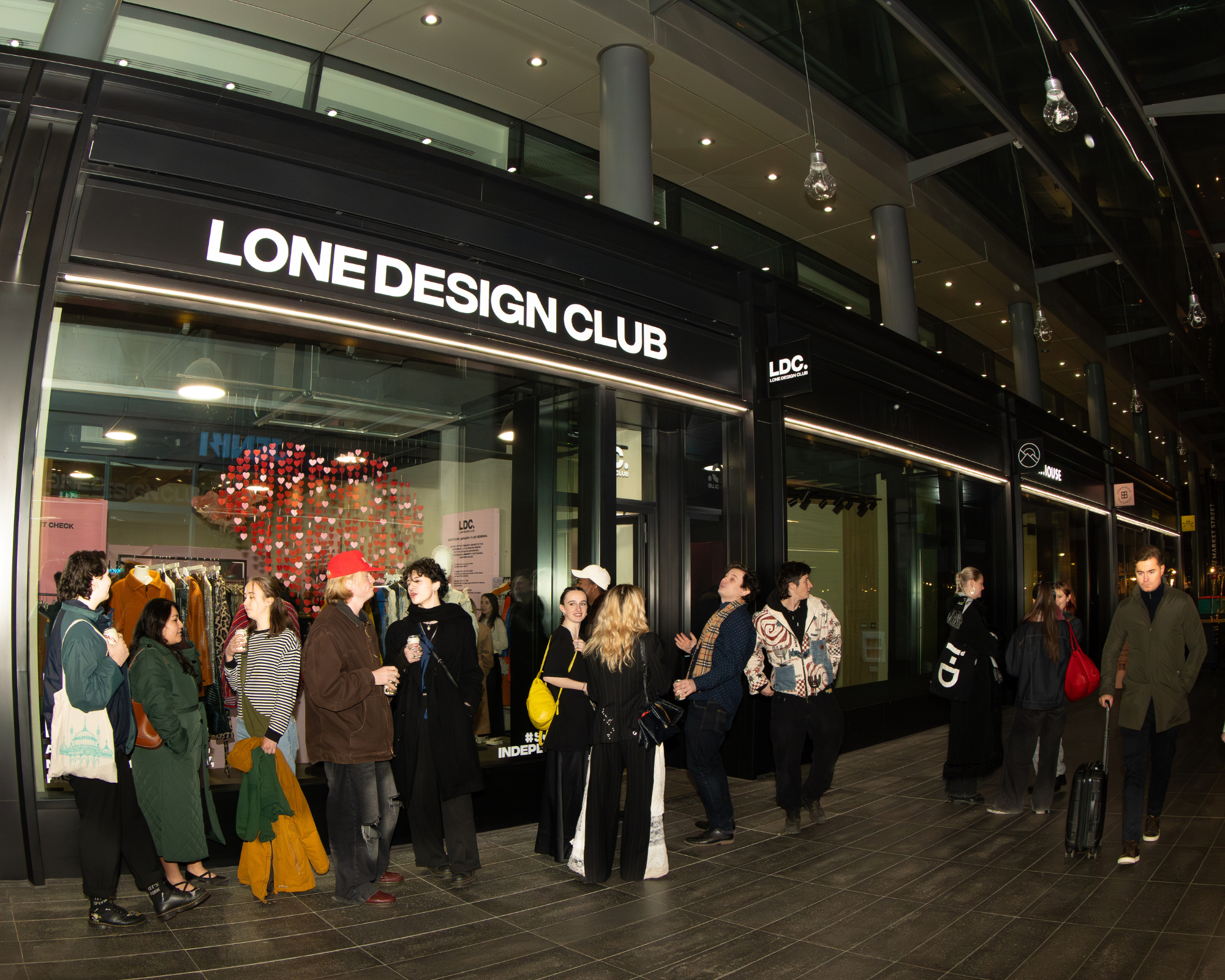 Shoppers spill outside a buzzy Lone Design Club pop-up concept shop.
