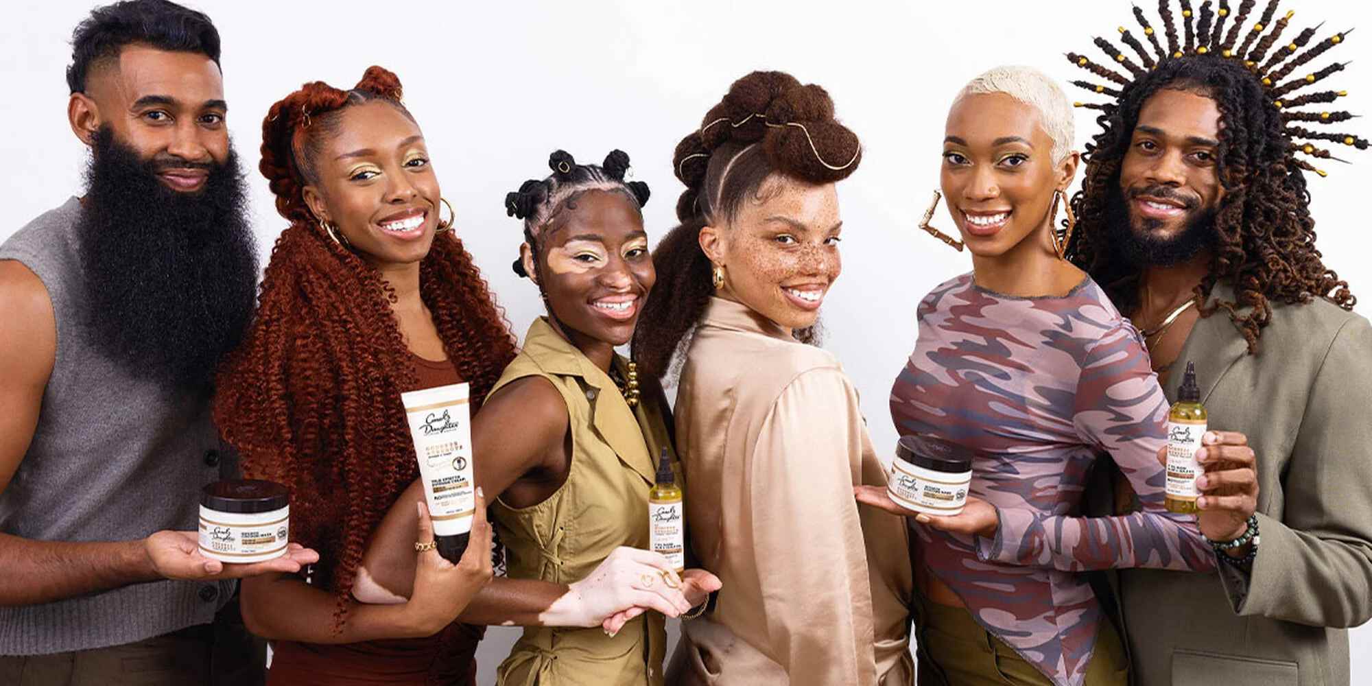 people holding products from carol's daughter