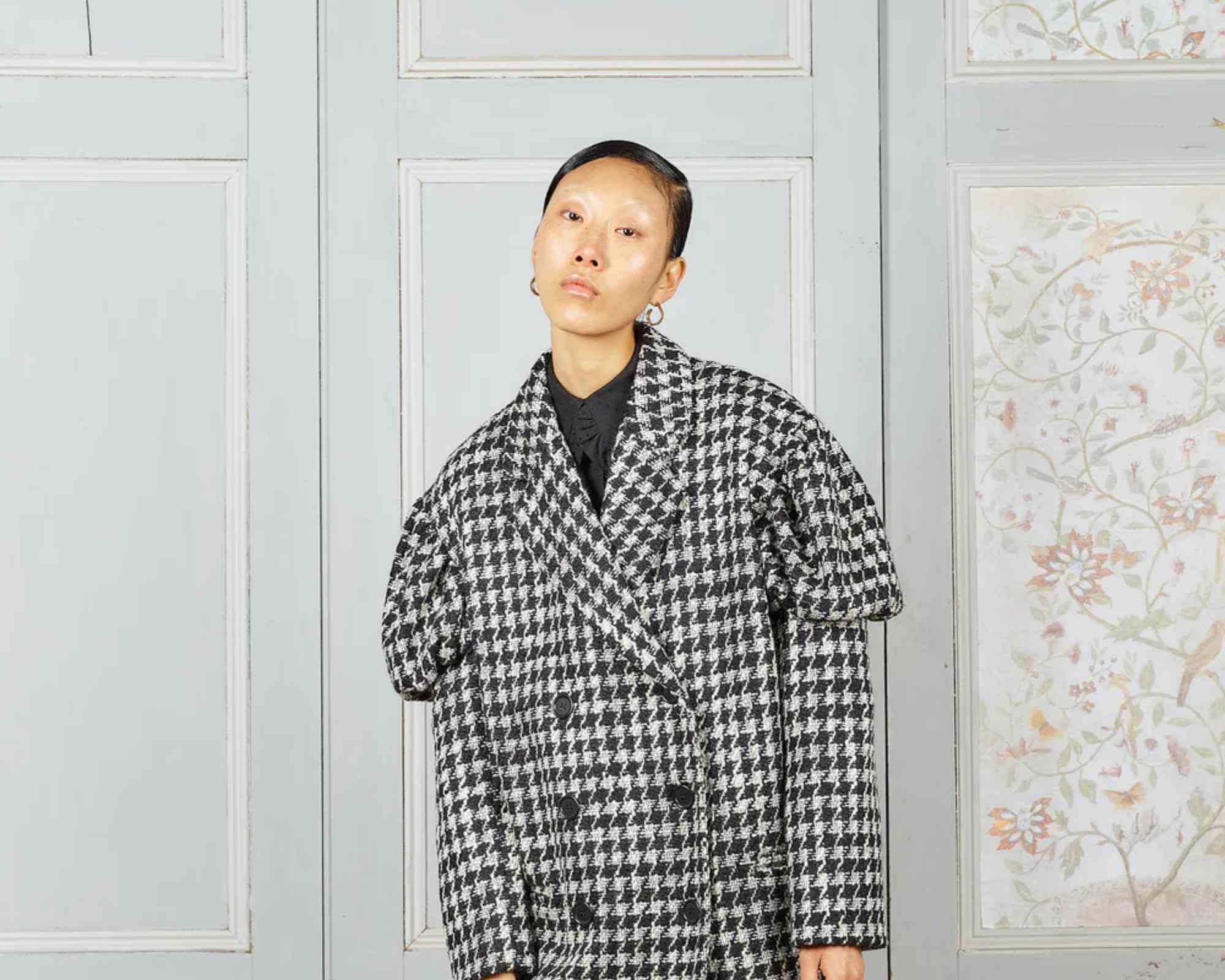 person wearing checked coat from kalaurie