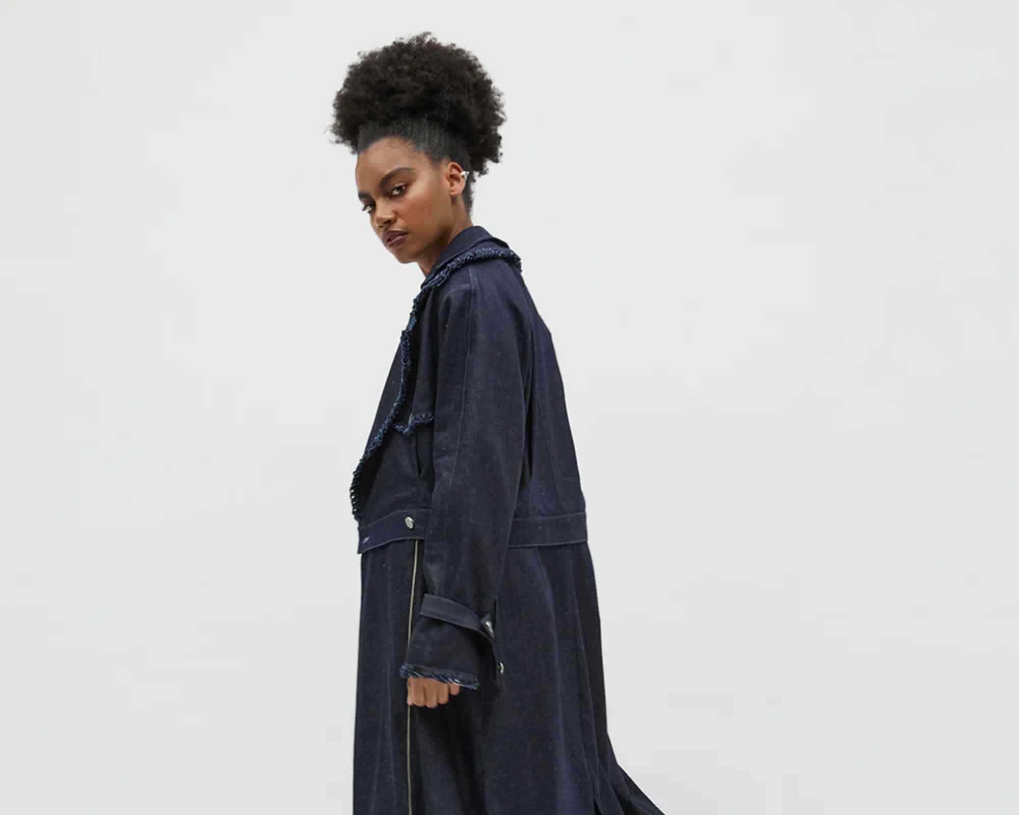 person wearing modest clothing - long coat from bastet noir