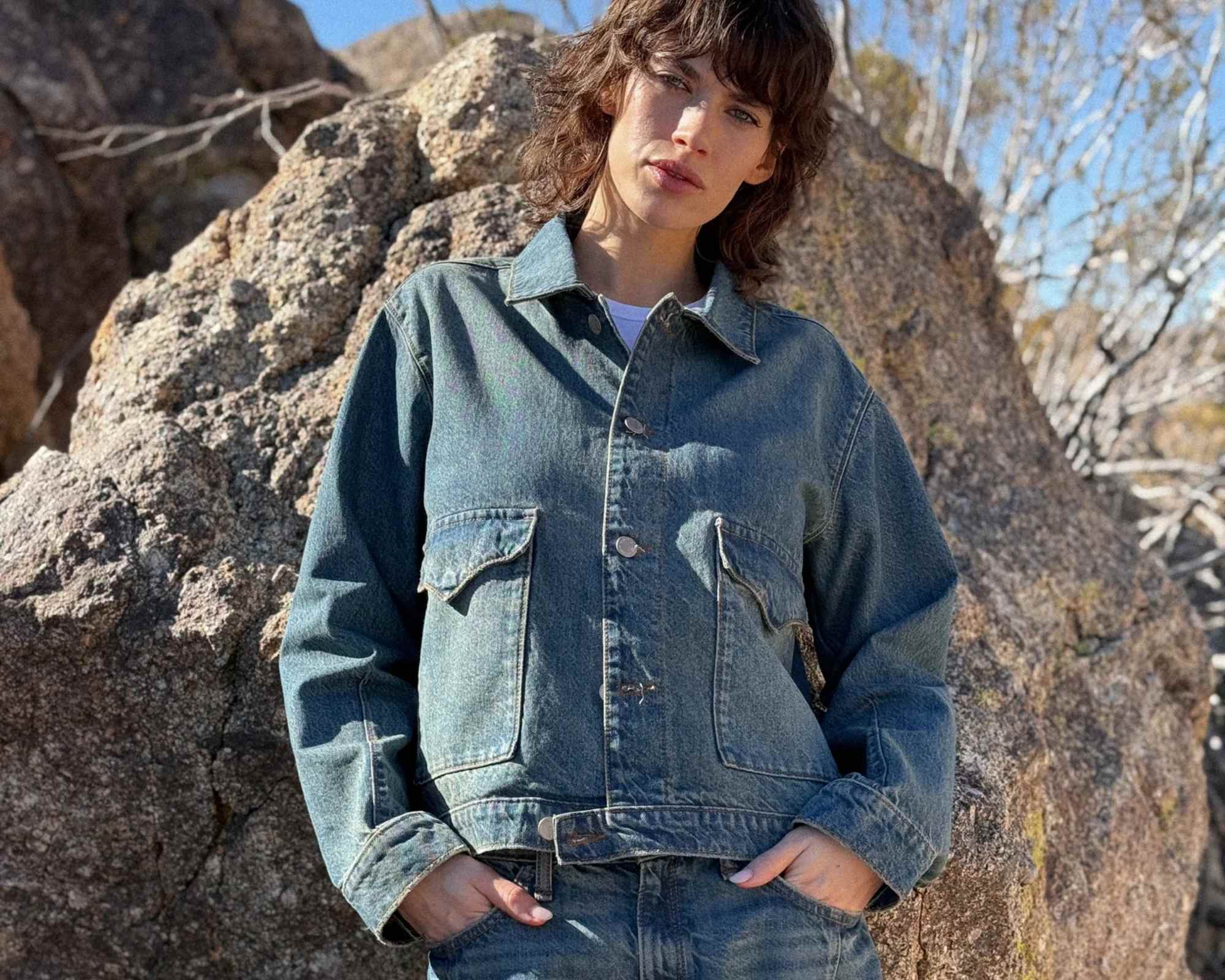person wearing denim outfit from more sustainable canadian brand triarchy