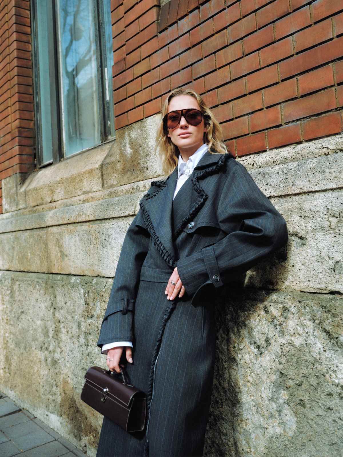 person wearing bastet noir trench coat