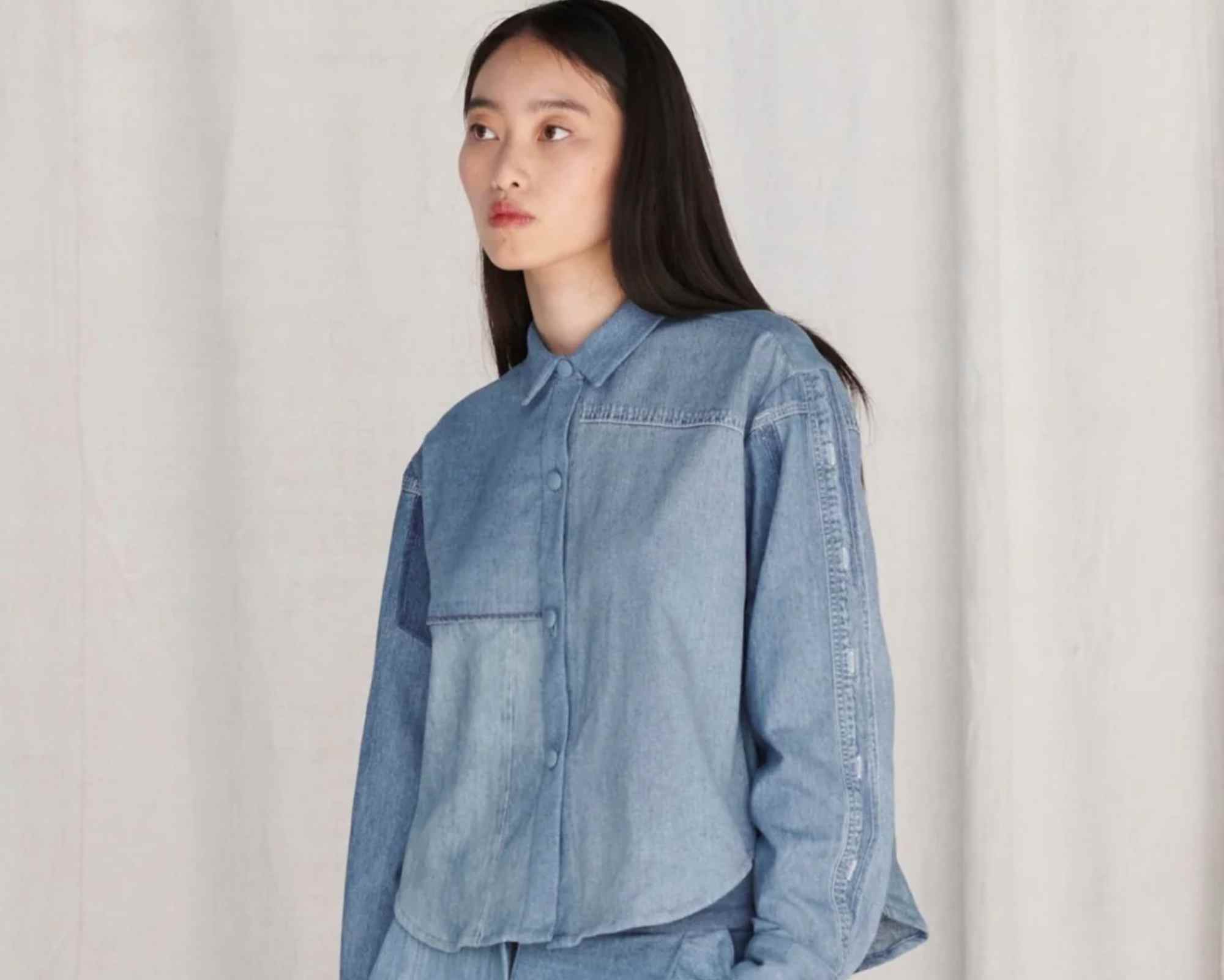 person wearing blue denim shirt from e.l.v denim