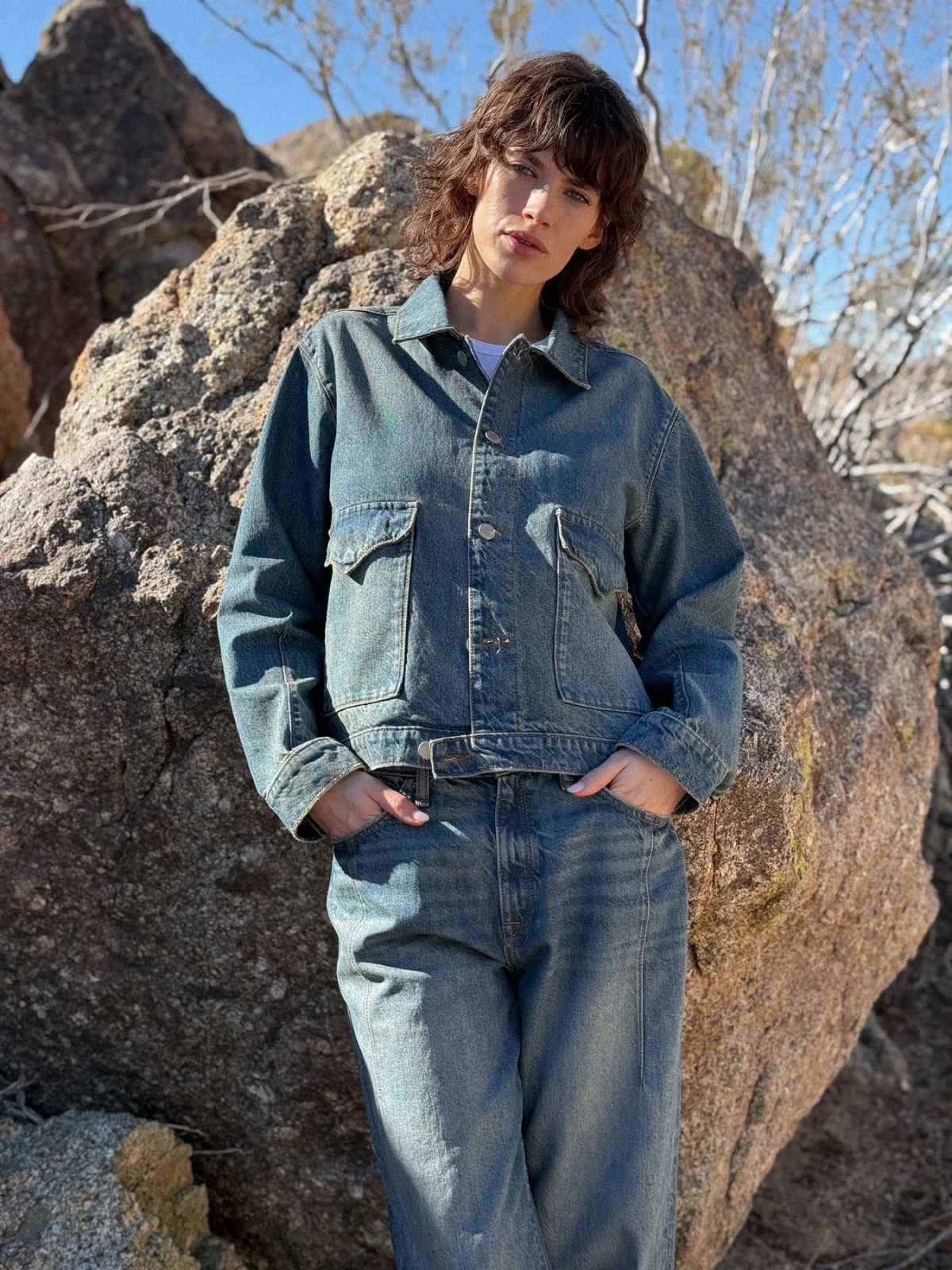 person wearing denim outfit from more sustainable canadian brand triarchy