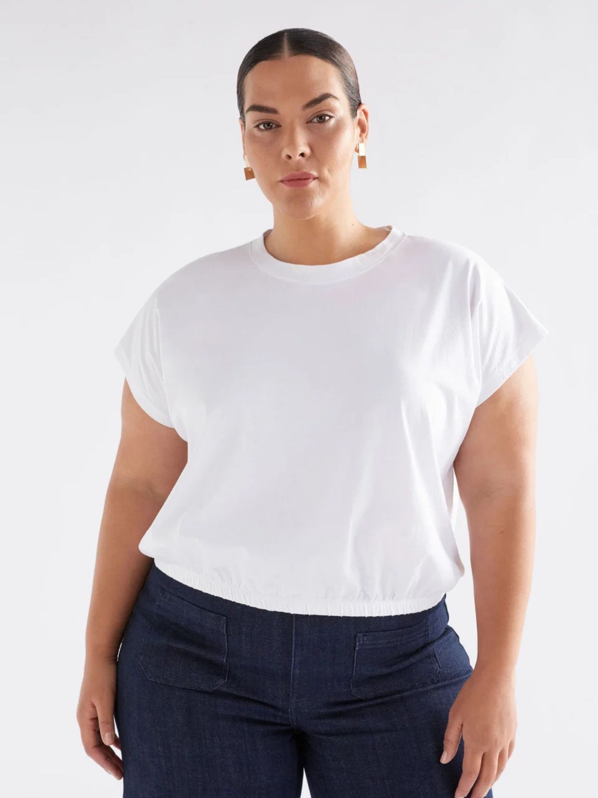 person wearing more sustainable white t-shirt from elk