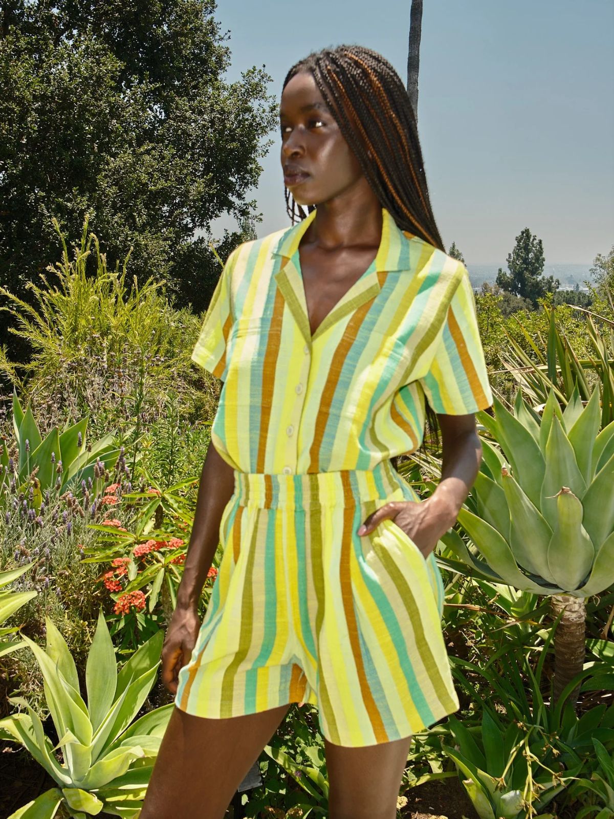 person wearing striped co-ord from more sustainable brand ace and jig