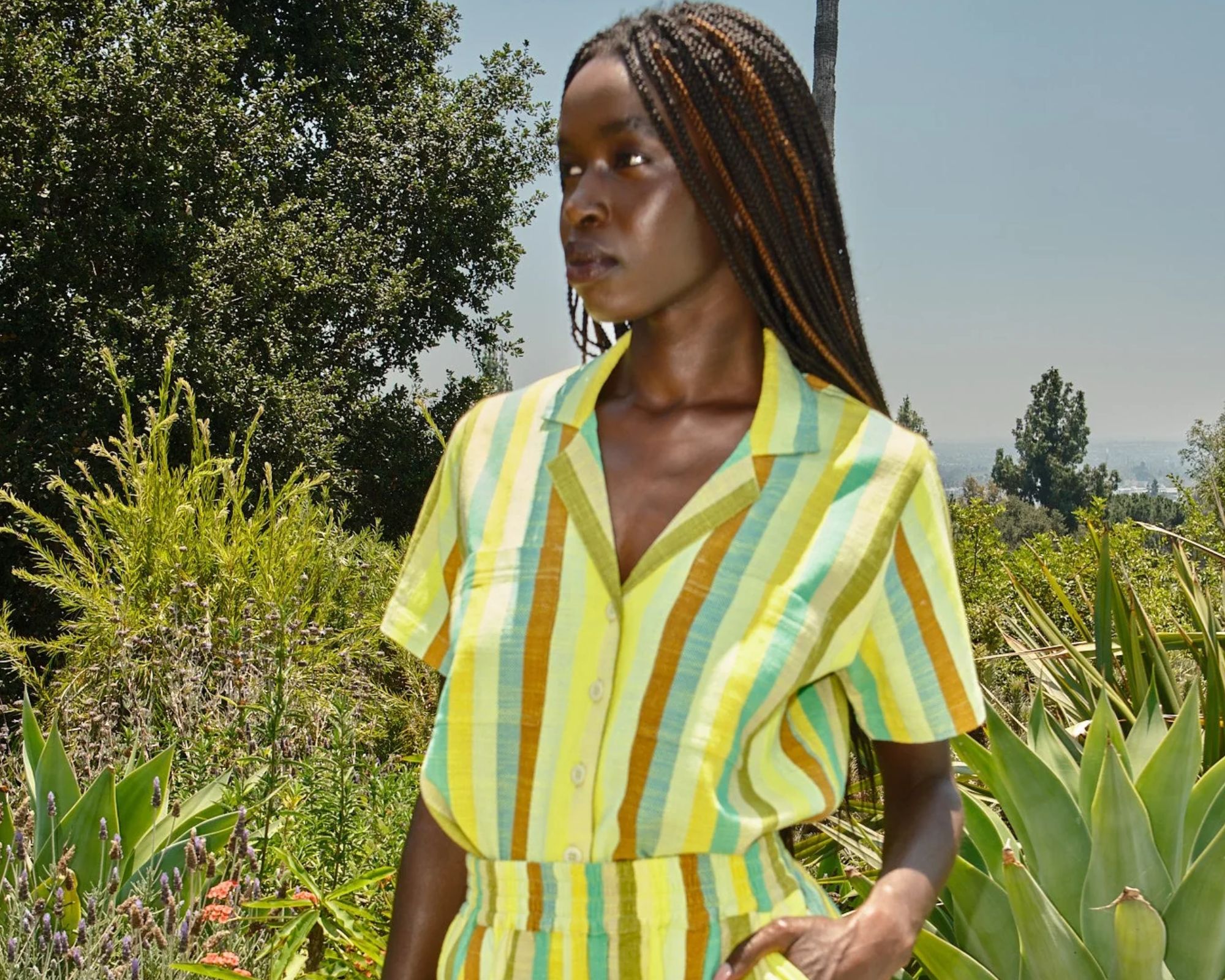 person wearing striped co-ord from more sustainable brand ace and jig