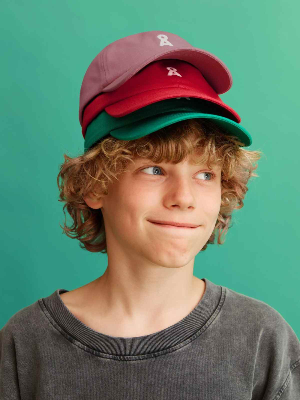 child wearing caps from more sustainable brand armedangels