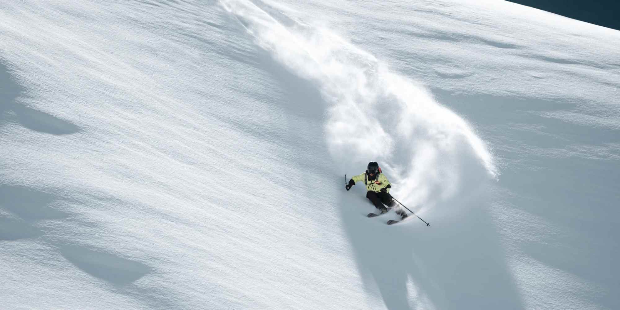 person skiing wearing mammut gear