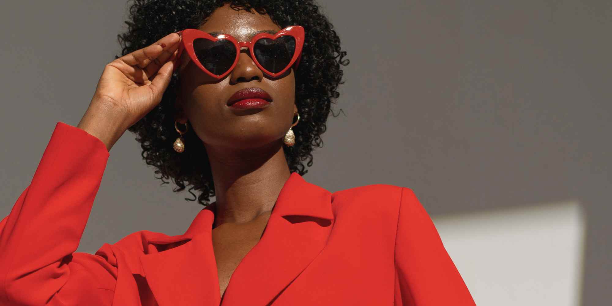 person wearing a red suit and sunglasses