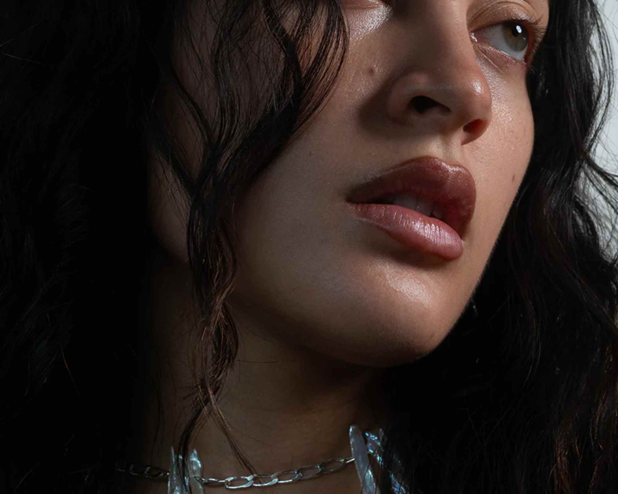 person wearing jewellery from serpent and the swan