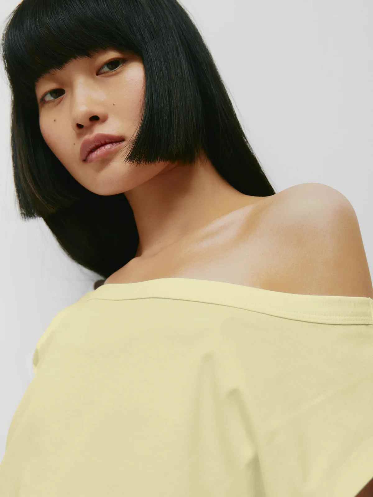 person wearing top from more sustainable canadian brand kotn