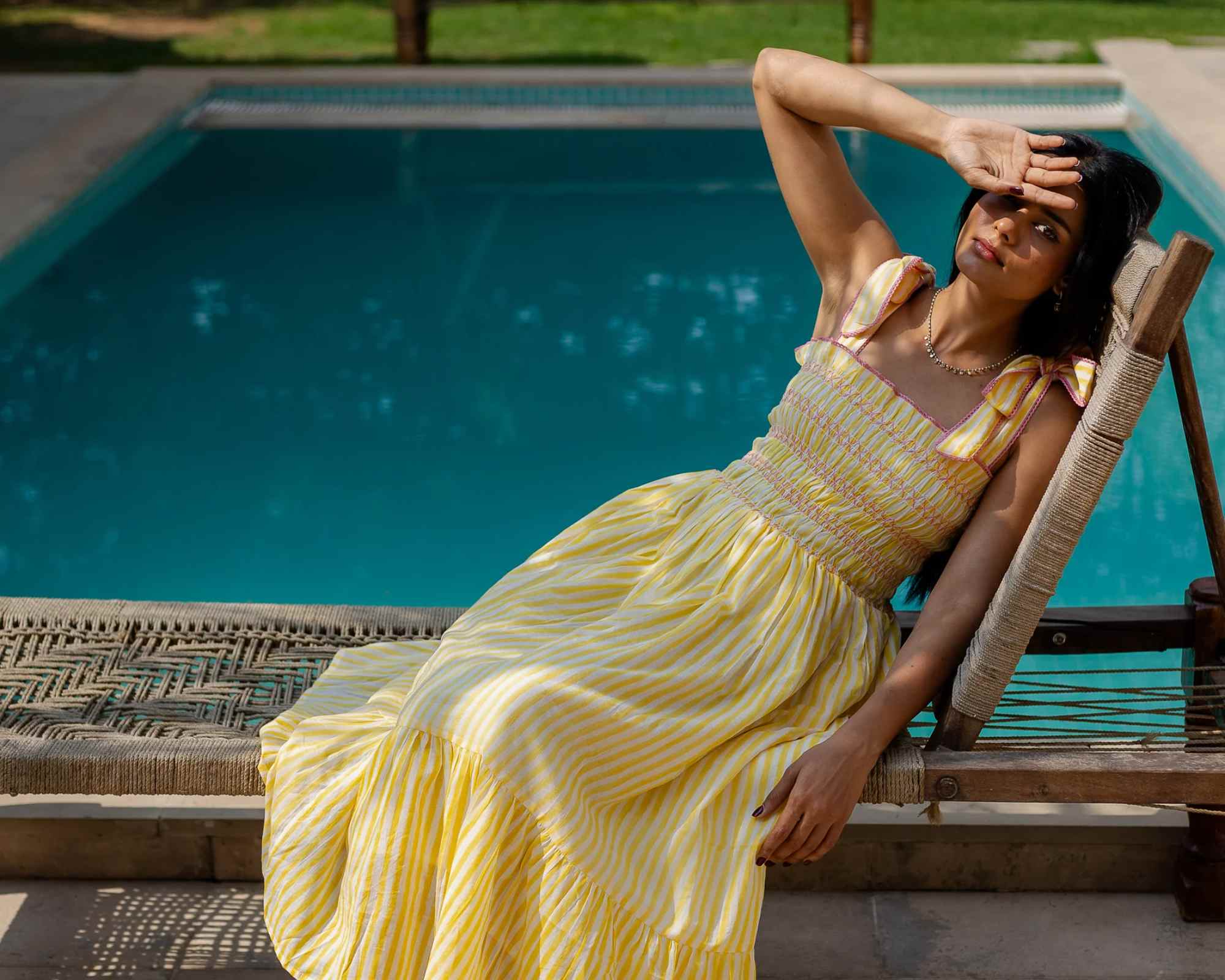 woman wearing striped dress from dilli grey