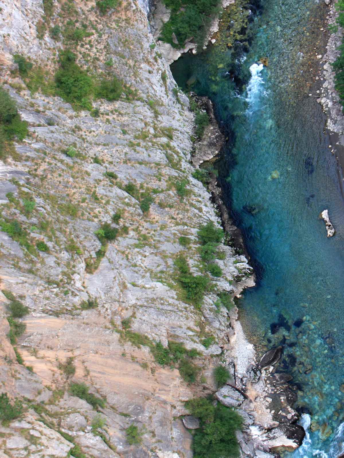 river and rock face from above