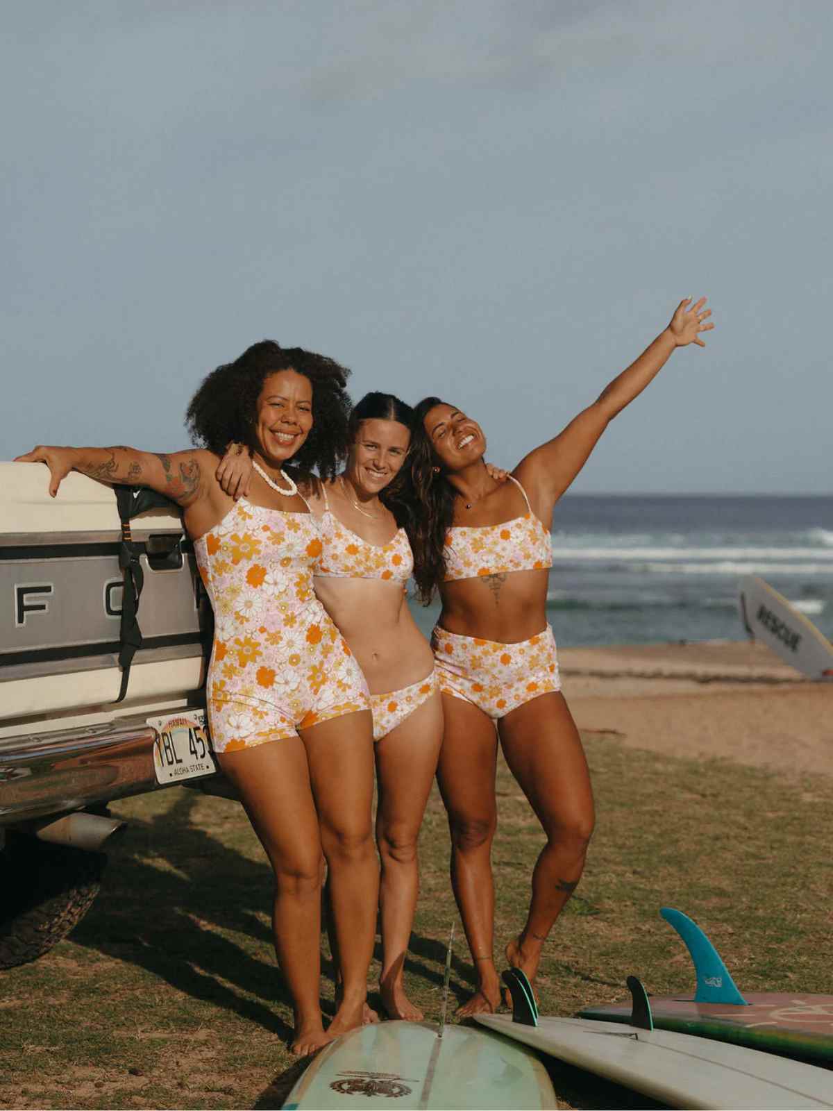 people wearing more sustainable swimwear from do good surf club