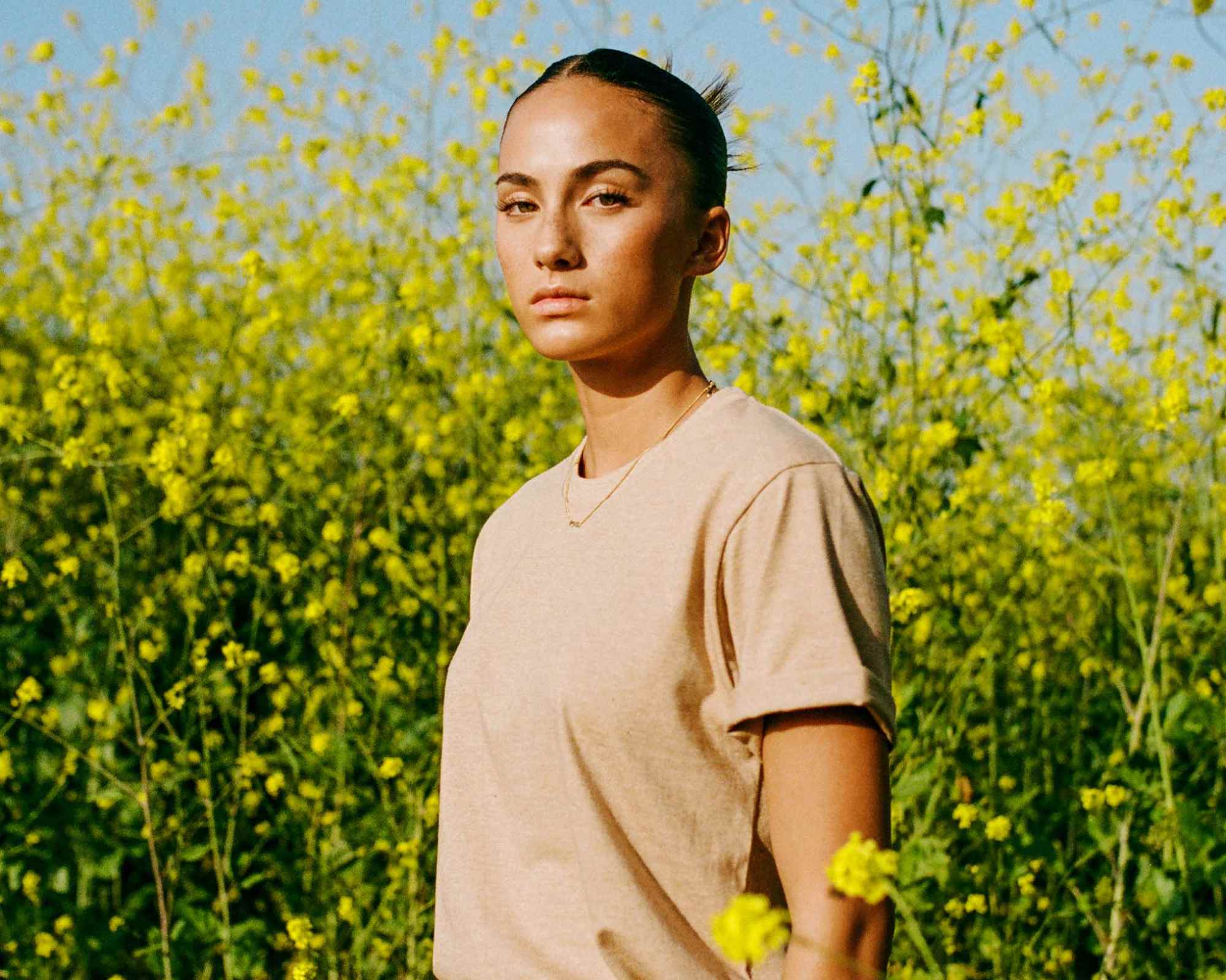 person wearing organic cotton vegan clothes from harvest and mill