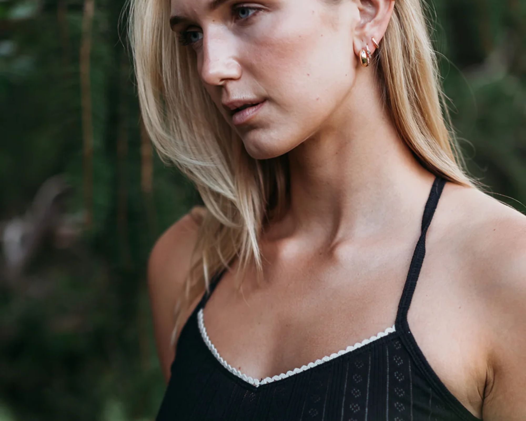 person wearing black pointelle tank top from q for quinn