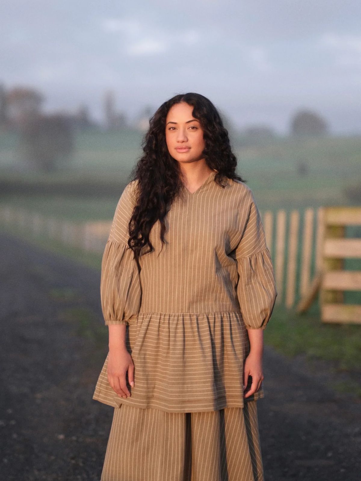 person wearing clothes from recreate standing in a field