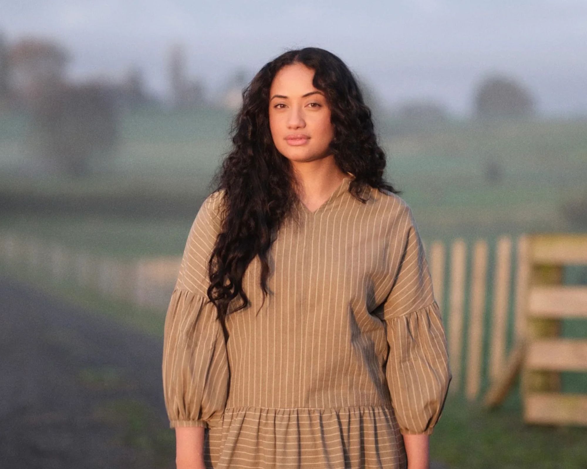 person wearing clothes from recreate standing in a field